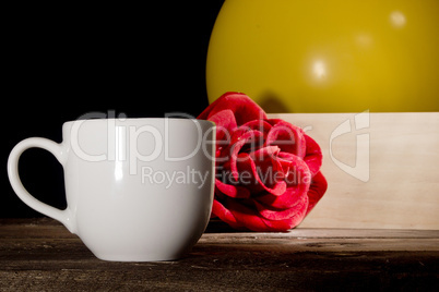 Cup of coffee and inflatable balls