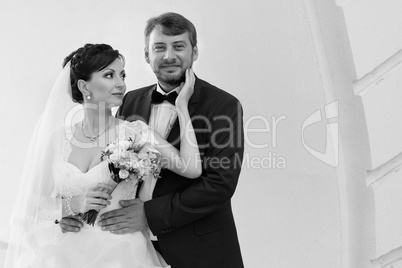 Groom in white shirt kissing bride hand. Very gentle photo