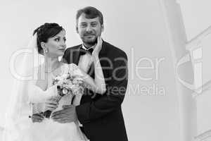 Groom in white shirt kissing bride hand. Very gentle photo