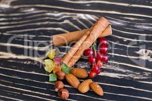 Nuts and candied fruits on the board texture