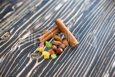 Nuts and candied fruits on the board texture