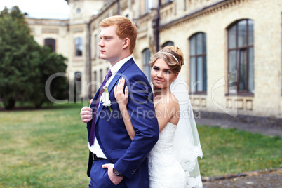 The bride groom gently embraced