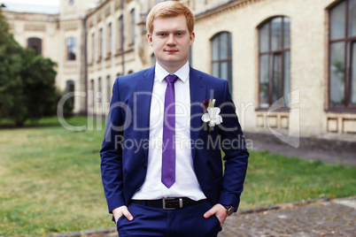 The groom in a lilac suit