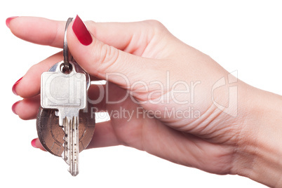 Close up of fingers curled around car keys