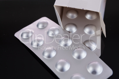 Silver blister pack of small pills
