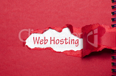 The word web hosting appearing behind torn paper