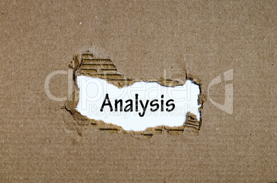 The word analysis appearing behind torn paper