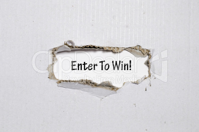 The word enter to win appearing behind torn paper