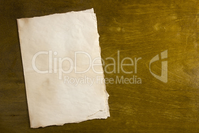 Grunge paper on wooden background