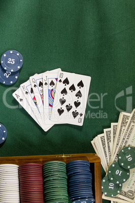 Cards with poker hand with chips and money