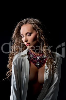 Glamour. Photo of sensual woman posing in jewels