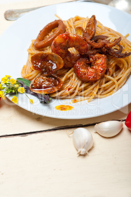 Italian seafood spaghetti pasta on red tomato sauce