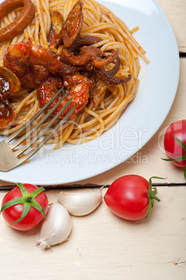 Italian seafood spaghetti pasta on red tomato sauce