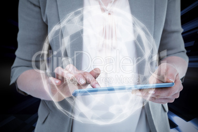 Composite image of close up of woman using tablet