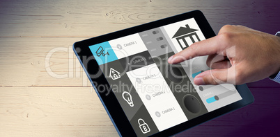 Composite image of man using tablet pc