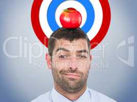 Composite image of businessman looking at the camera