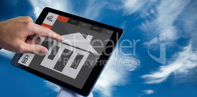 Composite image of man using tablet pc