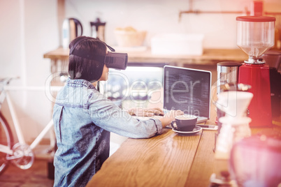 Young woman using the virtual reality headset