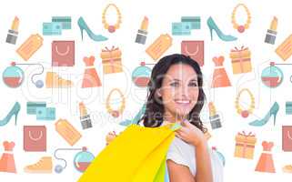 Composite image of pretty brunette with shopping bags
