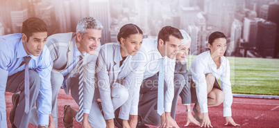 Composite image of business people preparing to run