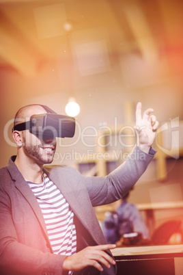 Male graphic designer wearing virtual glasses