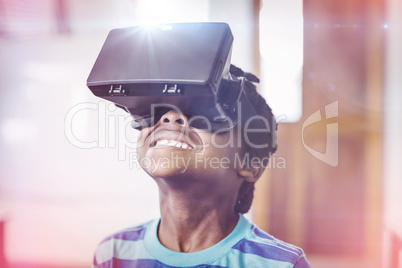 School boy in virtual reality glasses in classroom