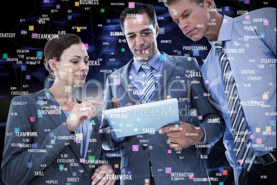 Composite image of businessman showing tablet to his colleagues