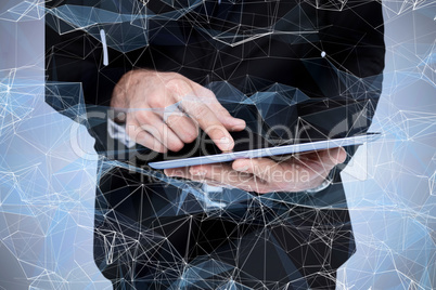 Composite image of mid section of a businessman touching digital