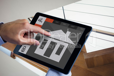 Composite image of man using tablet pc