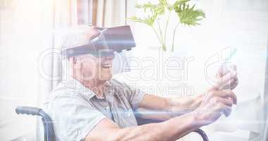 Senior man in a wheelchair using a virtual reality device