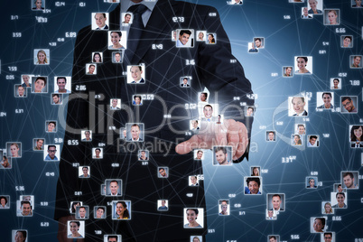 Composite image of businessman pointing