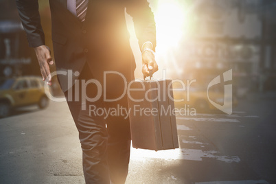 Composite image of businessman in hurry