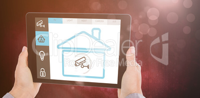 Composite image of cropped hand of man holding digital tablet