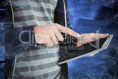 Composite image of cropped image of man using tablet