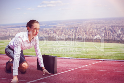 Composite image of businesswoman in starting position