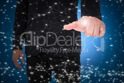 Composite image of businessman pointing with finger