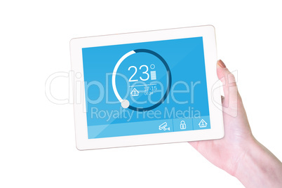 Composite image of feminine hand holding tablet