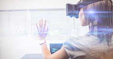 Businesswoman standing while using a virtual glasses