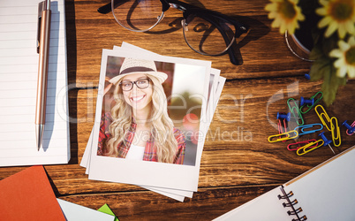 Composite image of gorgeous smiling blonde hipster posing