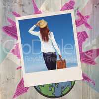 Composite image of rear view of hipster woman holding suitcase
