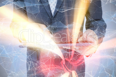 Composite image of  close up view of businessman using tablet co