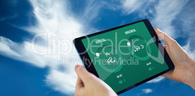 Composite image of hands holding tablet