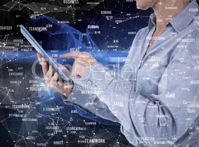 Composite image of businesswoman using her tablet