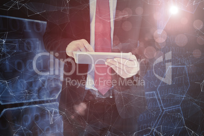 Composite image of businessman scrolling on his digital tablet Composite image of businessman scrolling on his digital tablet
