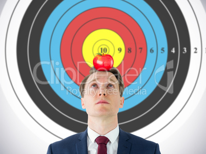 Composite image of serious businessman looking at top
