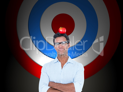 Composite image of confident man standing with arms crossed