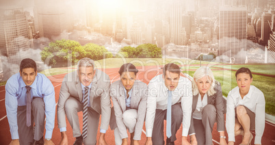 Composite image of business people preparing to run