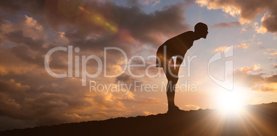 Composite image of profile view of sportsman posing his hands on