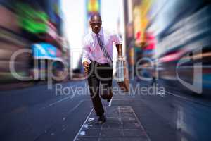 Composite image of businessman running