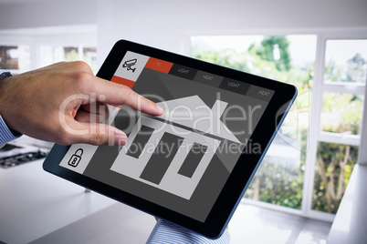 Composite image of man using tablet pc